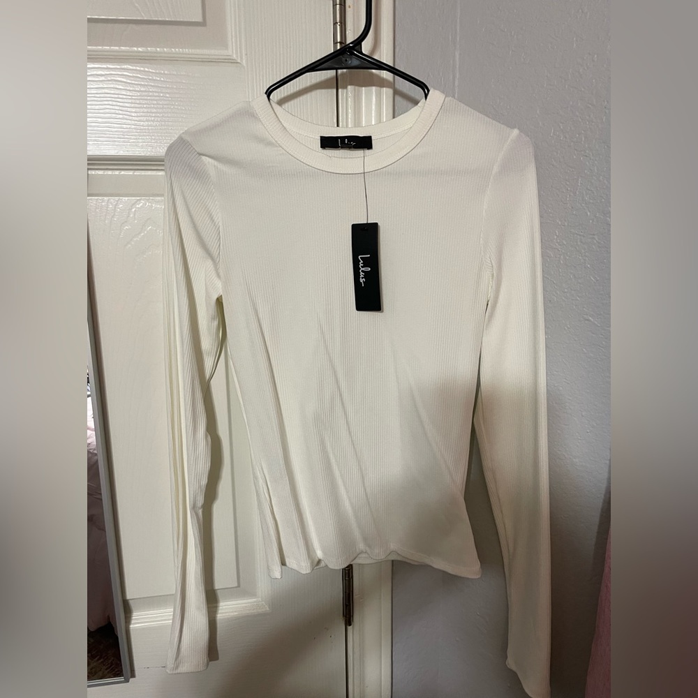 White ribbed knit long sleeve top. NWT
